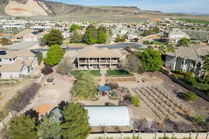 View of property location featuring mountains and nearby suburban area