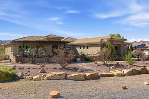 Prairie-style house with stucco siding and a tile roof