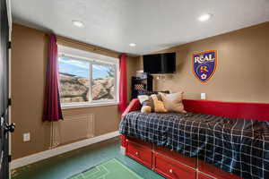 Bedroom with recessed lighting and a textured ceiling