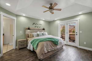 Bedroom with access to exterior, dark wood-type flooring, ceiling fan, and recessed lighting