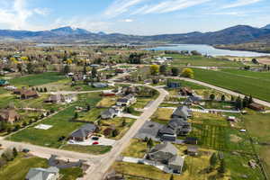 Aerial view of residential area featuring a water and mountain view