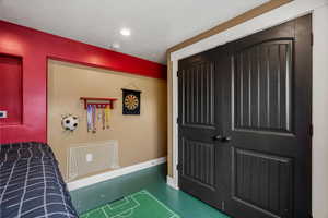 Bedroom featuring a closet and a textured ceiling