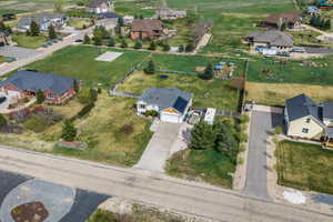 Aerial view of property's location featuring nearby suburban area