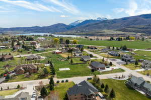 Aerial view of residential area featuring a water and mountain view