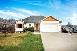 View of front of house with board and batten siding, driveway, a garage, and roof with shingles