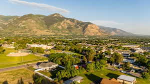 Aerial view of residential area featuring a mountain backdrop