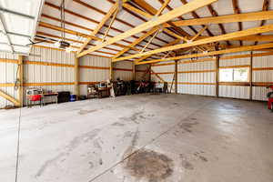 Garage with metal wall and a garage door opener