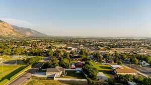 Aerial perspective of suburban area featuring a mountainous background