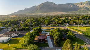 Aerial perspective of suburban area featuring a mountainous background