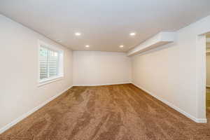 Basement featuring carpet flooring and recessed lighting