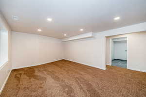 Finished basement featuring carpet flooring and recessed lighting