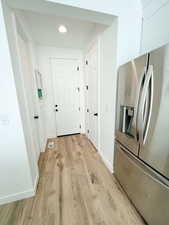 Entryway featuring wood finished floors and recessed lighting