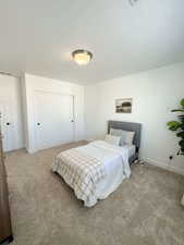Bedroom with carpet floors and a closet