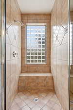 Full bathroom with a shower stall