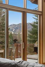 Bedroom featuring a mountain view and access to exterior