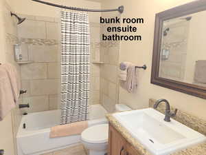 Ensuite bunk Full bathroom with vanity and shower / bath combo with shower curtain