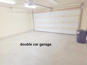 2 car garage featuring a garage door opener