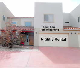 Mediterranean / spanish home featuring a tile roof, stucco siding, and concrete driveway