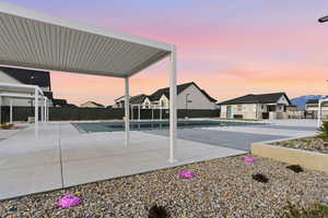 View of pool featuring a residential view and patio surround