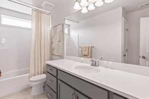 Full bath featuring vanity and shower / bath combo