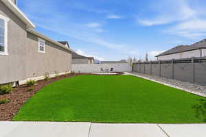 Fenced backyard featuring a patio area
