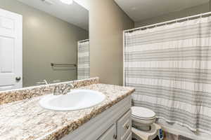 Bathroom featuring vanity and a textured ceiling