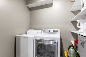 Laundry room featuring washing machine and dryer