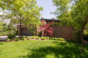 View of front of property with a front yard