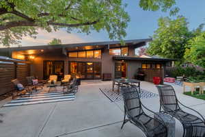 Back of property with a patio