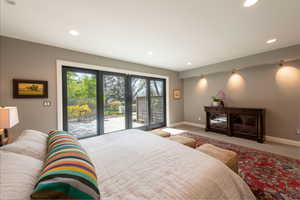 Bedroom with access to outside, carpet flooring, and recessed lighting