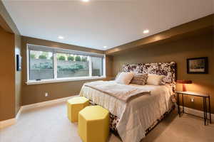 Bedroom with recessed lighting and light carpet