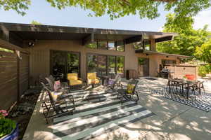 View of patio with outdoor furniture and area for grilling