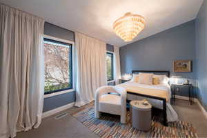 Bedroom with light colored carpet