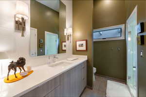 Bath with vanity and a stall shower