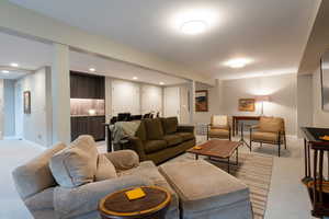 Living room featuring light colored carpet and recessed lighting