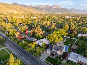 Aerial perspective of suburban area with a mountainous background