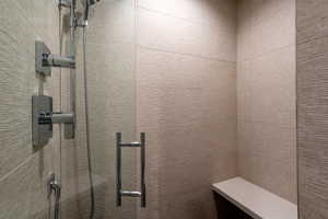 Bathroom featuring tiled shower