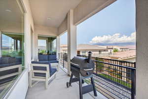 Balcony featuring grilling area and a residential view