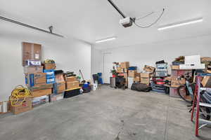 Garage featuring a garage door opener