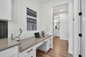Home office featuring light wood-style floors and recessed lighting
