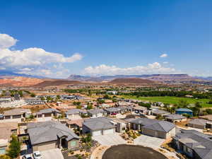 Aerial view of residential area featuring a mountain backdrop