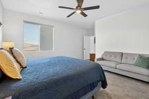 Bedroom featuring carpet and ceiling fan