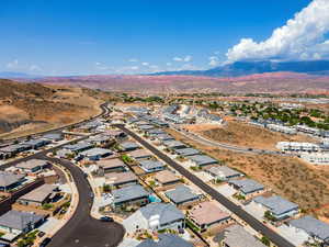 Aerial perspective of suburban area with a mountain backdrop