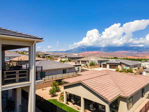Exterior space with nearby suburban area and mountains