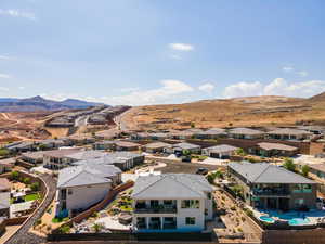 Aerial view of residential area featuring mountains