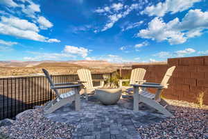 View of patio with a fire pit and a mountain view