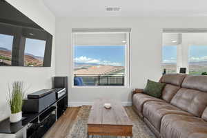 Living area featuring wood finished floors and plenty of natural light