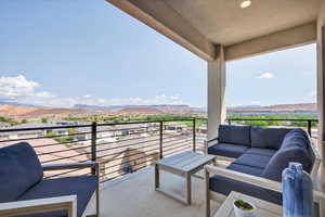 Balcony featuring an outdoor hangout area and a mountain view