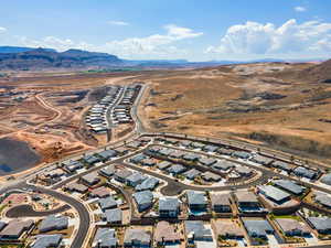 Aerial perspective of suburban area with a mountainous background