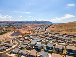 Aerial perspective of suburban area featuring a mountain backdrop